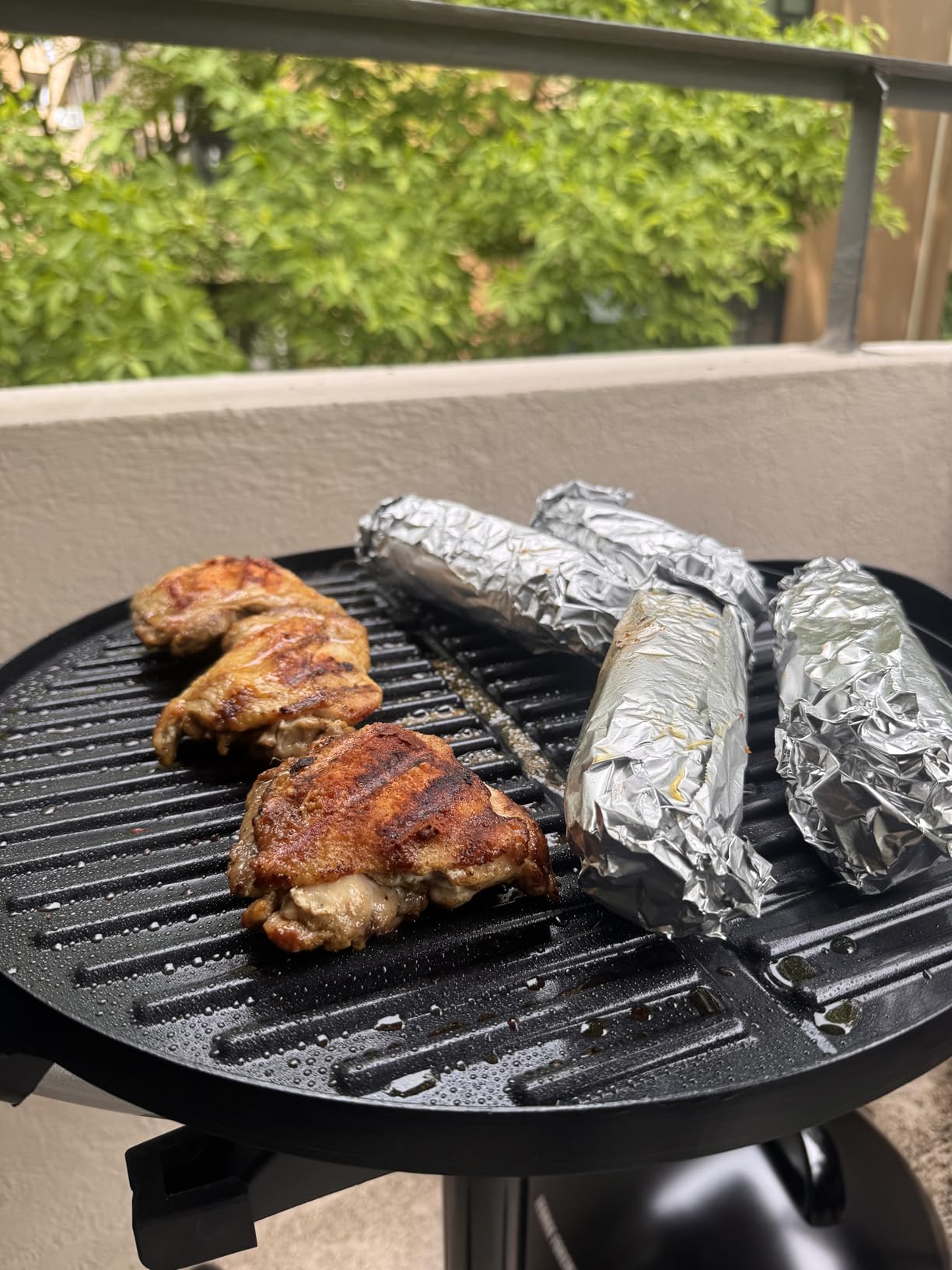 George Foreman Indoor/Outdoor Electric Grill with Stand, 15-Serving | 15-serving electric grill with removable stand, 5 heat settings and fat-removing slope for healthier grilling. customer photo 1