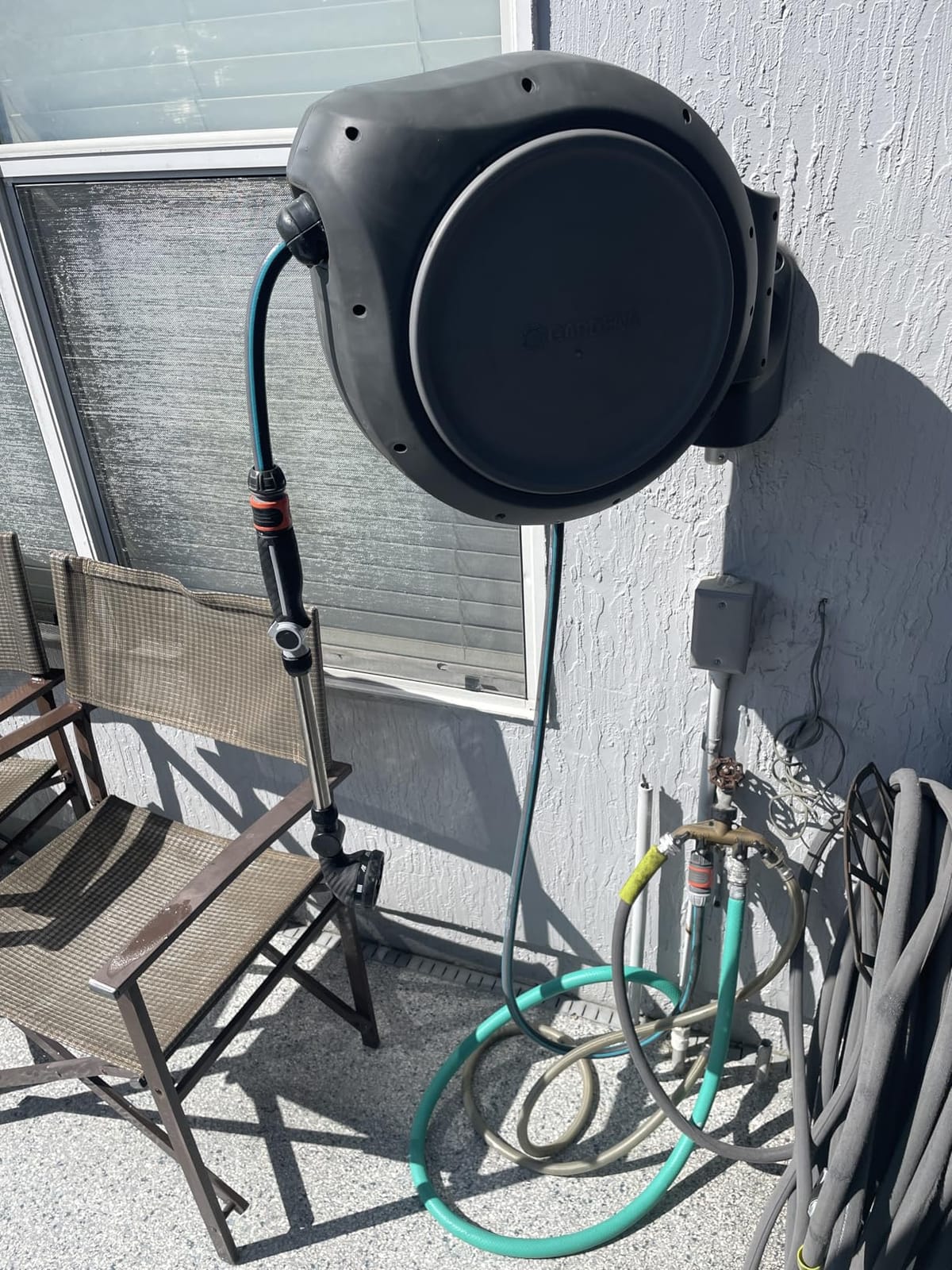 GARDENA Retractable Garden Hose Reel - 100 Feet - Auto Retract Hose Reel with 180° Swivel Wall Mount - Heavy Duty - Includes Spray Nozzle - 20505 customer photo 1