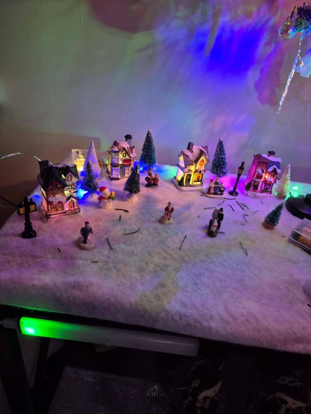 Gerrii 31 Pcs Christmas Village Figurines Decoration Set Lighted LED Christmas Village Houses with Figurines Snow Blanket Roll for Xmas Town Scene Desk Battery Operated Landscape Decor(Santa) customer photo 2
