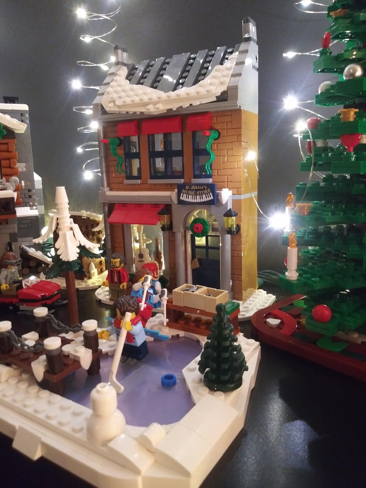 LEGO Holiday Main Street Building Kit, Christmas Village Adult Set for Families, Holiday Display Set with Shops, Streetcar and 6 Minifigures, Christmas Decoration to Build Together, 10308 customer photo 1