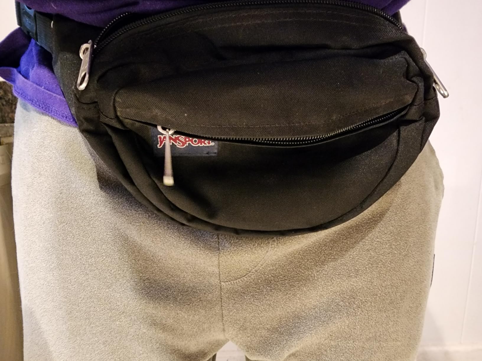 JanSport Fifth Avenue Fanny Pack Crossbody Bags for Women, Men - Stylish, Durable Waist Bag with Adjustable Belt, Main Zippered Pocket, Quick Stash Pocket, Travel Essentials, Black customer photo 2